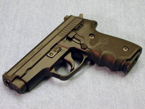 Sig Sauer P229 (with turning cheeks)