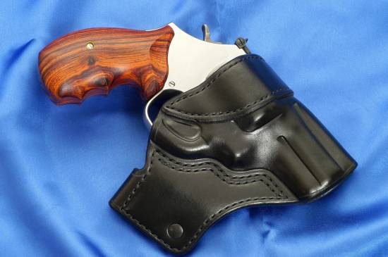 Smith & Wesson .357 Magnum in a holster (right)